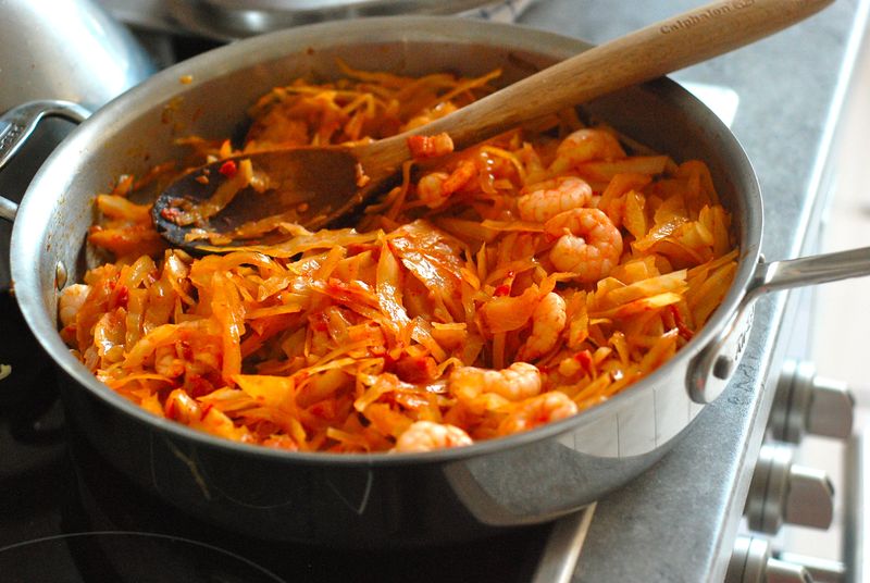 Spicy sautéed cabbage with shrimp, bacon and tomatoes Spicy sautéed cabbage with shrimp, bacon and tomatoes